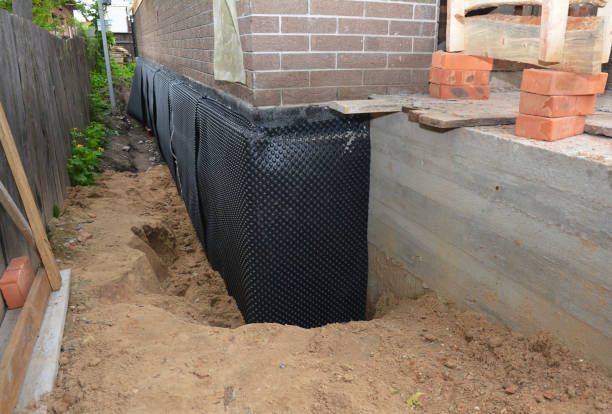 Happy homeowners after waterproofing job in Camby